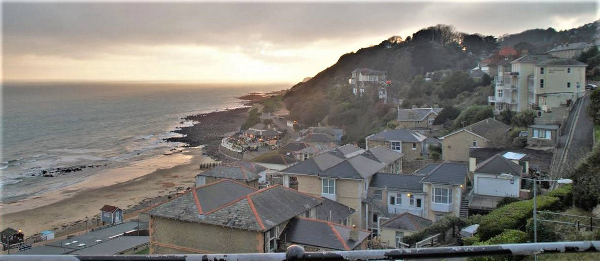 A coastal view of a sunset